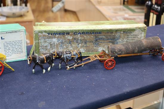 A collection of pre-war Britains Home Farm series models including a boxed farm wagon, boxed timber carriage, boxed tumbrel horse